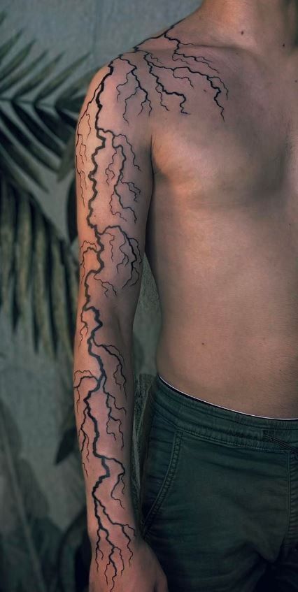 100 Electrifying Lightning Tattoo Designs - Tattoo Me Now White Ink Lighting Tattoo, Lightening Tattoo On Shoulder, Hand Tattoos Lightning, Lightning Tattoo Realistic, Glow In The Dark Tattoo Ideas, Amazing Tattoos For Guys, Zeus Lightning Tattoo, Lighting Tattoo Men, Fire Sleeve Tattoo