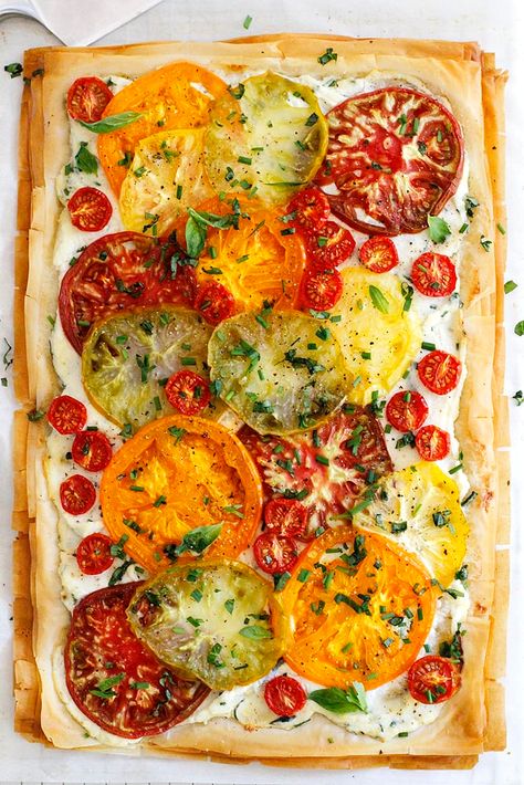 Tomato Ricotta Phyllo Tart Recipe -- An easy, fresh and flavorful phyllo tart with flaky pastry layers, chopped herbs, fresh heirloom tomatoes and a ricotta spread. girlversusdough.com @girlversusdough #girlversusdough #appetizer #easydinner Phyllo Tart, Tomato Tart, Tomato Pie, Savory Tart, Puff Pastry Recipes, Mango Salsa, Tomato Recipes, Tart Recipes, Pastry Recipes