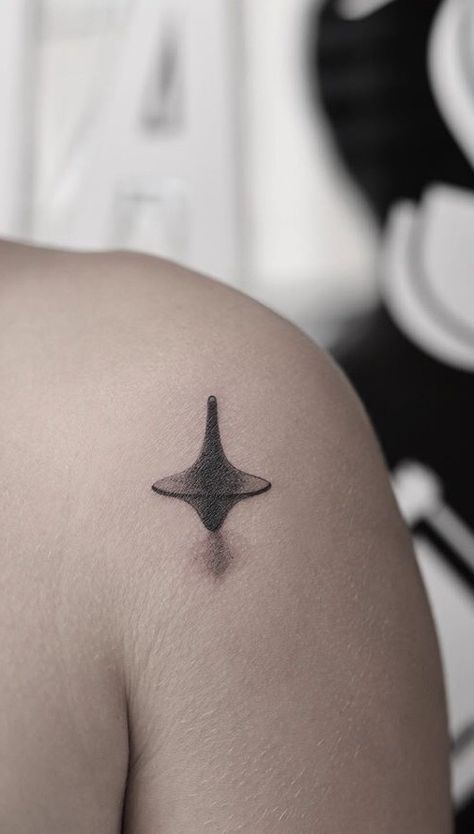 Inception Top Tattoo, Inception Spinning Top Tattoo, Station Eleven Tattoo, Inception Tattoo Ideas, Oppenheimer Tattoo, Spinning Top Tattoo, Tattoos About Loneliness, Bladerunner Tattoo, Interstellar Tattoo Ideas