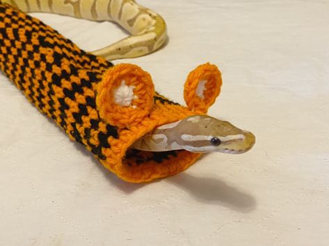 To customize with a name add this listing to your order: https://etsy.me/3nQyBll This adorable crocheted snake sweater is a fun little tube for your noodle <3 choose the diameter and length in the variations menu :) Great enrichment for your snake!  Not for providing warmth  Jude not included :)   PLEASE MAKE SURE YOUR ADDRESS IS UPDATED! if your order comes back to me because you put in the wrong address you will be responsible for the cost to ship it back out** **I ship orders tuesdays and fridays ** Comes from a pet loving smoke free home  TO GET YOUR ITEMS BEFORE HALLOWEEN PLEASE HAVE YOUR ORDER PLACED BY OCT 1ST TO ACCOMODATE AN INFLUX OF ORDERS - FOR CHRISTMAS PLEASE HAVE YOUR ORDERS IN BY NOVEMBER 20TH - ONCE THESE ITEMS SHIP, I CANNOT GUARANTEE HOW FAST THE POST OFFICE SHIPS THEM, Snakes Wearing Clothes, Snakes With Sweaters, Snake Sweater Crochet, Snakes In Sweaters, Crochet Snake Hide, Crocheted Snake, Snakes With Hats, Snake Sweater, Oct 1st