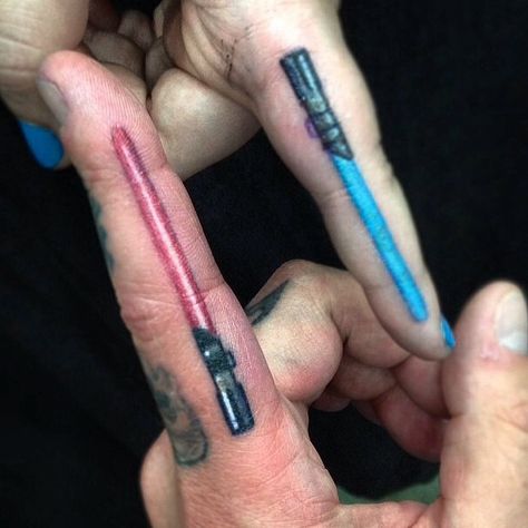 Lightsaber finger tattoos by Alonzo Villa-Bearcat Tattoo Gallery-Little Italy-San Diego, CA Wand And Lightsaber Tattoo, Finger Lightsaber Tattoo, Green Lightsaber Tattoo, Count Dooku Lightsaber Tattoo, Minimal Lightsaber Tattoo, Matching Friend Tattoos, Finger Tats, Ring Finger Tattoos, Ring Tattoos