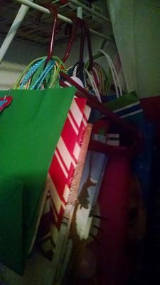 Hang gift bags on hangers to organize them {plus more ideas for how to organize gift bags on Home Storage Solutions 101} Gift Bag Organizer Storage Ideas, Organizing Gift Bags Storage Solutions, Organize Gift Bags, Organizing Wrapping Paper And Gift Bags, Storing Gift Bags And Tissue Paper, Store Gift Bags, Wrapping Center, Gift Wrap Organizer, Bags Organization