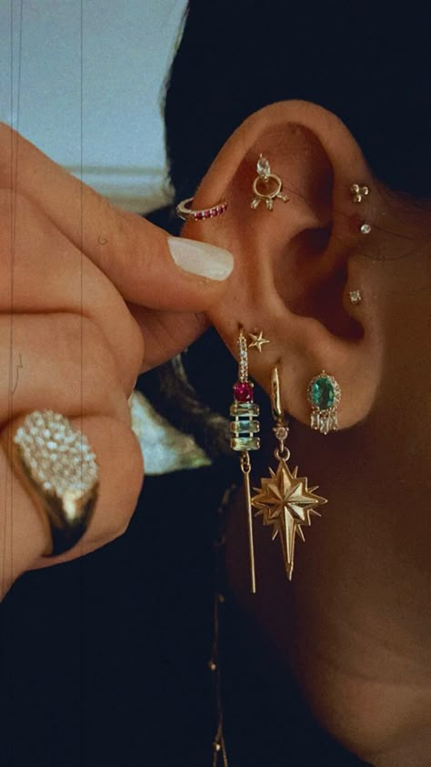 Dangling Ear Piercings, Super Pierced Ears, Folded Ear Piercing, Earring Layering Ideas, Colorful Ear Curation, Curated Piercing Ideas, Beautiful Ear Piercings, Gold Earring Arrangement, Ear Party Inspiration