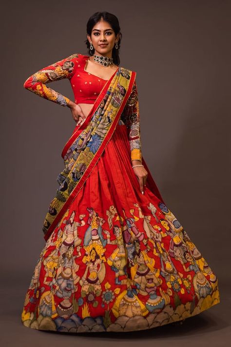 Red attached cancan lehenga with ajantha concept kalamkari hand painted patterns. Paired with  padded red blouse embroidered with glass beads and green hand painted dupatta with contrast border. - Aza Fashions Chikankari Lehenga With Kalamkari Dupatta, Kalankari Lehangas Blouse Design, Birthday Traditional Outfits, Kalamkari Lehangas Designs, Penkalamkari Lehanga, Pen Kalamkari Lehangas, Kalamkari Half Saree Designs, Kalamkari Lehenga Designs, Kalamkari Half Saree