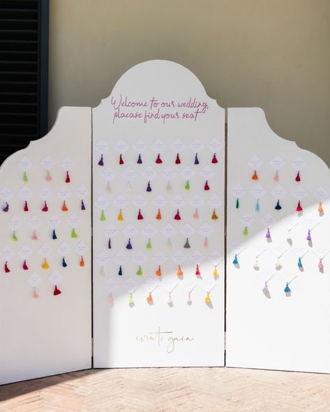 Love this creative seating chart from a beautiful wedding I planned 🌈💕 Guests were greeted with this charming tri-fold backdrop, inviting them to find their seats in #style. The backdrop is elegantly simple with a heartfelt “Welcome to our wedding, please find your seat” written at the top. Each guest’s name is displayed on a diamond-shaped card, accented by a bright, colorful tassel that adds a playful and festive touch. The variety of colors used for the #tassels creates a vibrant and joy... Creative Seating Chart, Creative Seating Cards, Creative Seating, Guatemala Wedding, Find Your Seat, Personalized Wedding Decor, Seating Cards, Wedding 2025, Welcome To Our Wedding