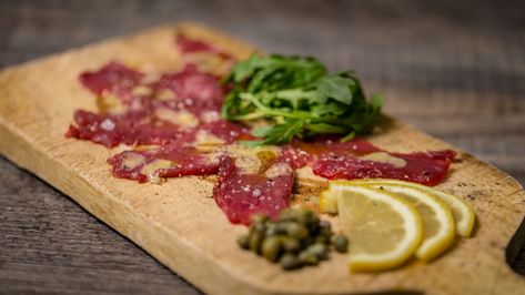 MeatEater Cook - Venison Carpaccio Recipe Venison Carpaccio, Wild Game Dinner, Carpaccio Recipe, Axis Deer, Raw Tuna, Game Meat, King Kamehameha, Wild Game Recipes, Sliced Meat