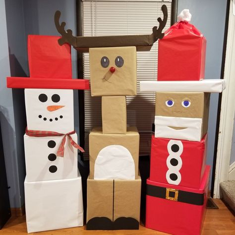 Decided to wrap the kiddos presents in a fun way.  Gifts wrapped as Santa, a snowman, and reindeer. 5 gifts for each kid!  Easy way to keep track. Used big moving boxes to fit a Colossal Trex! #stackablepresents Reindeer Present Tower, Snowman Presents Tower, Christmas Gift Wrapping Ideas For Kids, Unique Gift Wrapping Christmas, Christmas Wrapping Diy, Christmas Presents For Kids, Gift Towers, Christmas Boxes, Reindeer Gifts