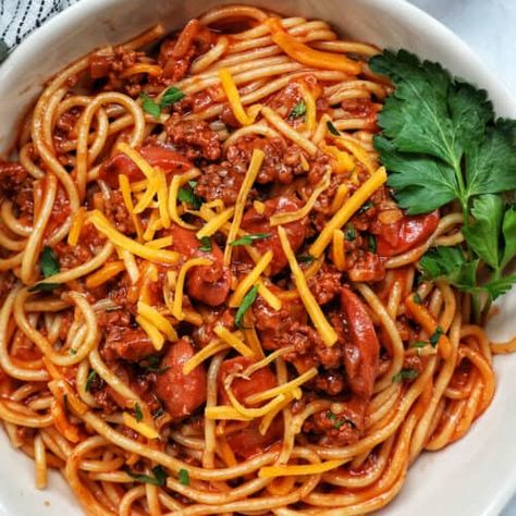 Jollibee Spaghetti Recipe - Urban Bliss Life Jollibee Spaghetti Recipe, Spaghetti Filipino, Jollibee Spaghetti, Hot Dog Pasta, Filipino Spaghetti, Banana Ketchup, Bee Food, Sausage Spaghetti, Beef Hot Dogs