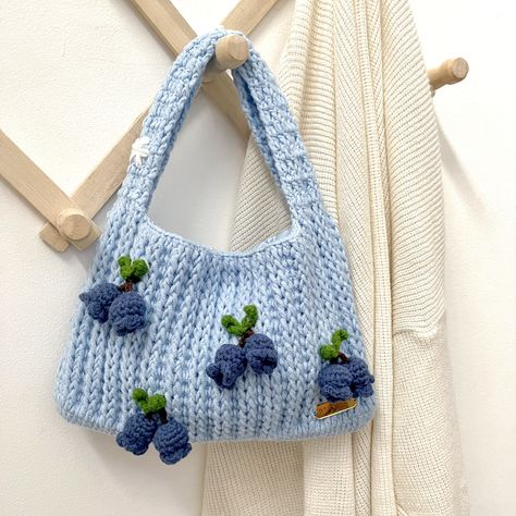 Blueberry Crochet Handbag with Daisy🫐 This crochet bag is small and minimalist but you can put a lot of things in it!  The basic color is blue combined with small blueberries plushie, making it even cuter, and you can really use it when taking photos while traveling. OH and also, on the handle of the bag there are 3 daisy flowers which make this bag even more unique and cute! -- YOU CAN'T FIND IT ANYWHERE ELSE! -- 🌿Size approximately :       - Width = 23,5 cm      - Length (without strap) = 15 cm 🌿Strap length : +- 23 cm 🌿This crochet bag is made with natural cotton 🌿What will you get when purchase this lovely crochet bag? -The crochet bag -BONUS : mini mirror and more🤩 -You will get the right procedure for washing crochet, so that the product can last longer ⛔️NOTE = This item is no Crochet Blueberry Bag, Small Crochet Items, Plushie Making, Cute Crochet Purse, Blueberry Crochet, Small Crochet Purse, Blue Crochet Bag, Mini Crochet Bag, Small Crochet Bag