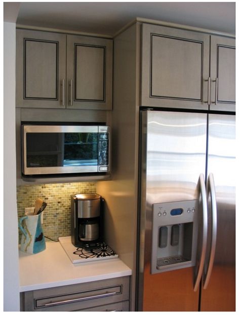 The cabinet is 12" in depth (the shelf is about 15"). Microwave a Panasonic. We added a horizontal filler to close the gap above it and make it look more built-in. GE's Spacemaker and Sharp also makes a few which can go into a 15" deep cabinet. :: pinned from Houzz thread Layout Kitchen, Microwave Shelf, Curtains Kitchen, Remodel Diy, Farmhouse Kitchen Remodel, Kabinet Dapur, Microwave In Kitchen, Eclectic Kitchen, Kitchen Remodel Before And After