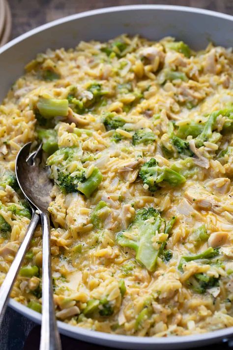 Creamy Chicken and Broccoli Orzo is a flavorful dish that combines orzo pasta, rotisserie chicken, and broccoli with a rich white cheddar cheese sauce. It is not only cheesy and delicious, but it is all made in one skillet for easy preparation and cleanup! Rotisserie Chicken And Broccoli, Chicken And Broccoli Orzo, Broccoli Orzo, Creamy Chicken And Broccoli, Orzo Pasta Recipes, Spicy Sausage Pasta, Broccoli Cheddar Chicken, Creamy Orzo, Cheddar Cheese Sauce