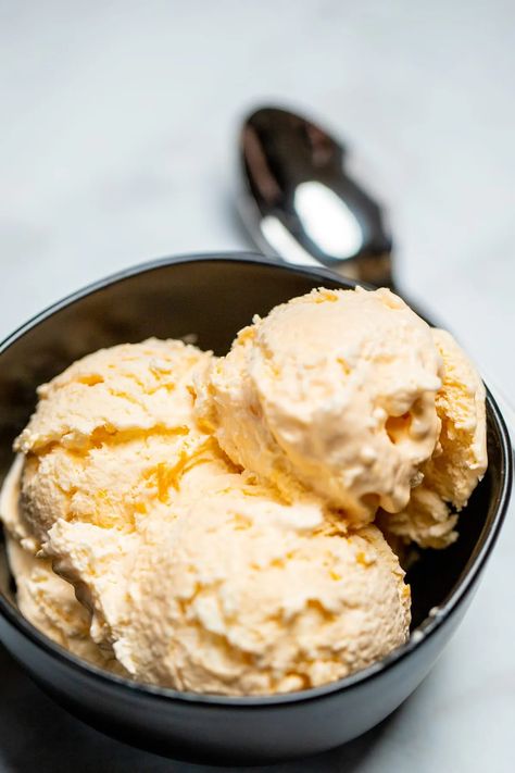 No Churn Orange Ice Cream is quick and easy to make, made with heavy cream, sweetened condensed milk, orange juice, vanilla, and a pinch of salt, then frozen until you're ready for dessert! Orange Creamsicle Ice Cream, Creamsicle Ice Cream, Sea Salt Ice Cream, Orange Ice Cream, Gluten Free Ice Cream, Orange Food Coloring, Ice Cream Dishes, Ice Cream Mixture, Homemade Vanilla Ice Cream