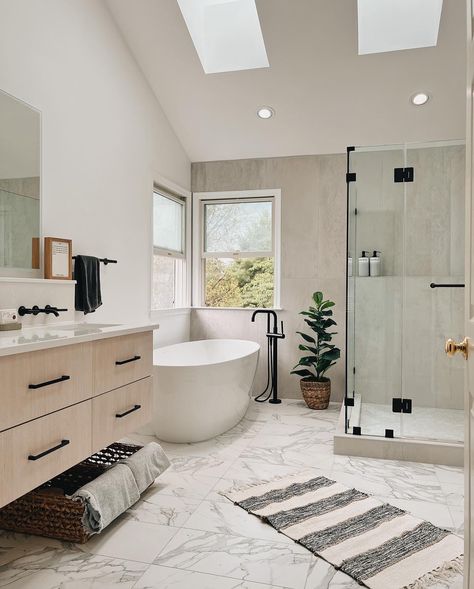 The result? A peaceful and tranquil oasis. 🤍 Introducing our latest bathroom renovation project - a peaceful bliss bath! 🛁 Our team combined light wooden cabinets, ceramic tiles, and a walk-in shower to create a tranquil oasis for our client. And let’s not forget the stunning free-standing tub, perfect for unwinding after a long day. ✨ The end result is a beautiful and functional space that exudes peace and serenity. 🌿 #bathroomrenovation #peacefulbliss #tranquiloasis #interiordesign #bath... Bathroom Remodel Before And After, Mediterranean Bathroom Design Ideas, Modern Bathroom Makeover, 2024 Bathroom, Tub Remodel, Kitchen And Bathroom Remodeling, Bathroom With Tub, Standing Shower, Open Showers