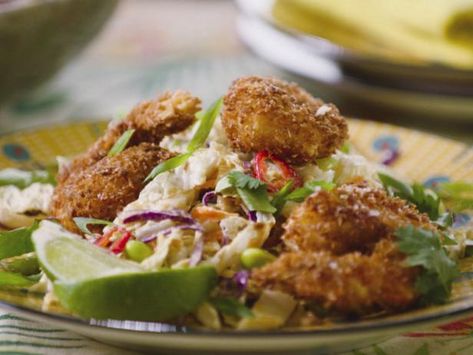 Jeff Mauro tosses shaved Napa cabbage, hearty edamame and crispy coconut shrimp with a sweet and nutty dressing for an easy weeknight meal. Coconut Shrimp Salad Jeff Mauro, Jeff Mauro Coconut Shrimp Salad, The Kitchen Jeff Mauro Recipes, Coconut Shrimp Salad, Snacks For Dinner, Mini Pigs In A Blanket, Napa Salad, Easy Egg Roll, Egg Roll Bowl