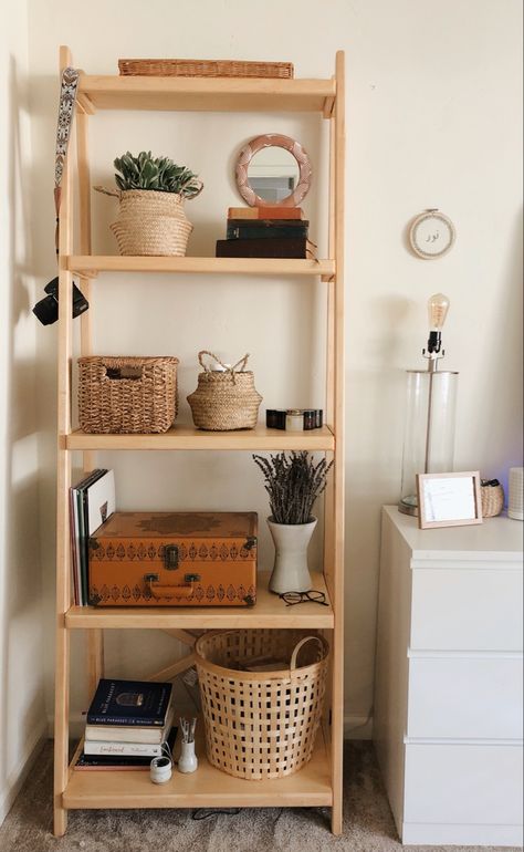 simple and funtional bookshelf. super cute boho bookshelf decorated with plants, a record player, and baskets carrying everything you need! Bookshelf Basket Storage, Bookshelf With Baskets, Standing Basket Shelf, Basket Bookshelf, Bookshelf Boho, Boho Bookshelf, Boho Wicker Shelf, Rattan Furniture Standing Shelves, Standing Bookshelf