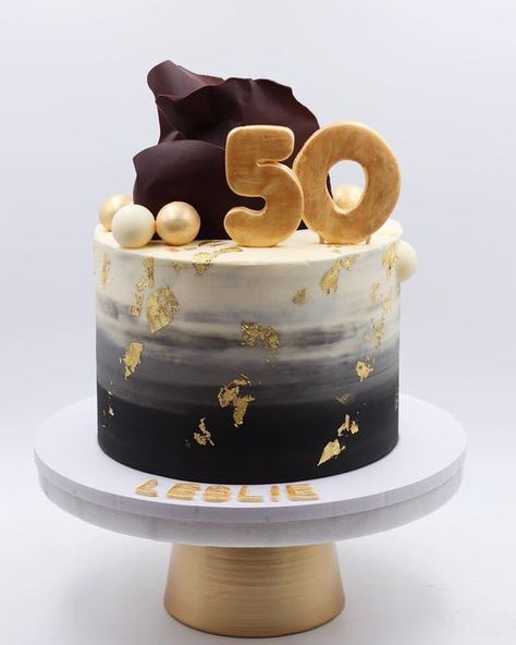 Manar Hassan . Cake Artist on Instagram: "Ombré black & white, edible gold leaf, and chocolate decoration for a 50th celebration 💛 #craftsycakes #50years #50yearsold #50yearscake #ediblegoldcake #cakedecorating #dubaibaker #dubaibakery #uaecake #cakeart #cakeartistdubai #uaebirthday" 50th Birthday Cake For Men Turning 50, White Black And Gold Cake, Black White Gold Cake, 50 Birthday Cake, Black And Gold Birthday Cake, Travel Cakes, 50th Birthday Cakes For Men, Gold Cake Decorations, Birthday Cake For Father