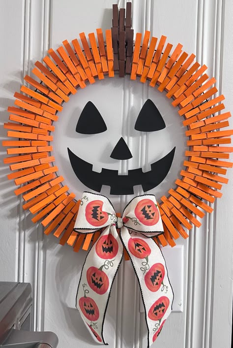 Halloween Jack-o-Lantern clothespin wreath measures 16" wide x approx. 24" long(which includes from the top of the stem to the bottom of the bow) .. handmade by me....&& made for the Halloween lover in you!  if you love decorating for the Halloween season you will  love love love this Jack-o-lantern wreath !!  It looks awesome on the front door as well as  hanging on your wall anywhere in your house ! All clothespins are hand painted by me & hot glued to the wire wreath! ️🦇 Halloween Reefs Front Doors, Clothespin Wreath Diy, Halloween Wreath Ideas Diy, Clothespins Wreaths, Pallet Vanity, Wreath Ideas Diy, Halloween Wreaths For Front Door, Guisada Recipe, Halloween Clothespin