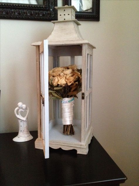 We dried my wedding bouquet and keep it closed up in this glass latern. I still have the charm on it that my goddaughter made me. Sleeve Wedding Dress Lace, Wedding Shadow Box, Wedding Bouquet Preservation, Long Sleeve Wedding Dress, Budget Ideas, Bouquet Preservation, Wedding Dress Lace, Long Sleeve Wedding Dress Lace, Hair Raising