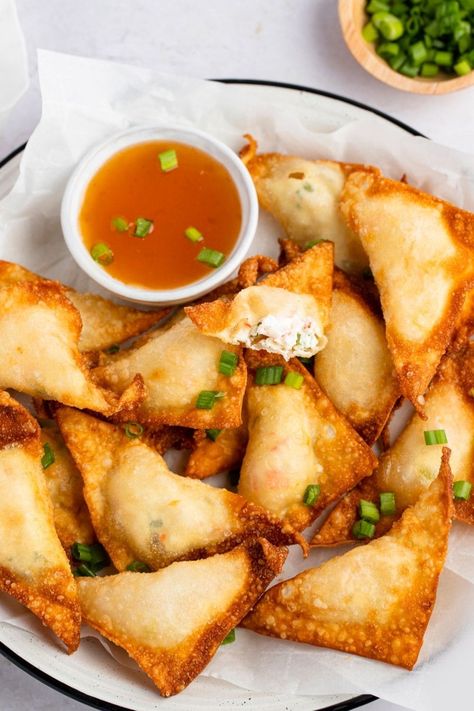 If you love crab rangoon, then you'll adore lobster rangoon! Learn how to make this easy recipe, plus, get tips for the best rangoon every time. Lobster Rangoon, Deep Fried Wontons, Lobster Appetizers, Seafood Meals, Bite Size Snacks, Creamy Parmesan Sauce, Lobster Salad, Crab Rangoon, Healthiest Seafood