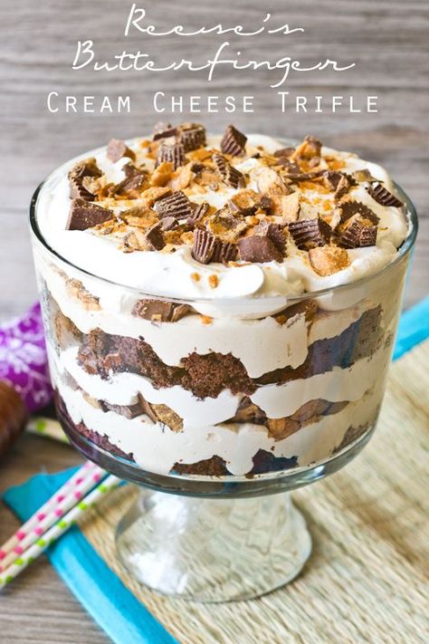 Reese’s Butterfinger Cream Cheese Trifle {Tastes of Lizzy T} Peanut butter and chocolate lovers will go crazy over this Reese’s Butterfinger Cream Cheese Trifle. It has an Oreo cake layered with fluffy cream cheese filling and chopped up Butterfinger and Reese’s cups! Butterfinger Trifle, Cream Cheese Trifle, Dessert Trifles, Punch Bowl Cake Recipe, Trifle Bowl Recipes, Punch Bowl Cake, Trifle Dessert Recipes, Trifle Recipes, Trifle Pudding