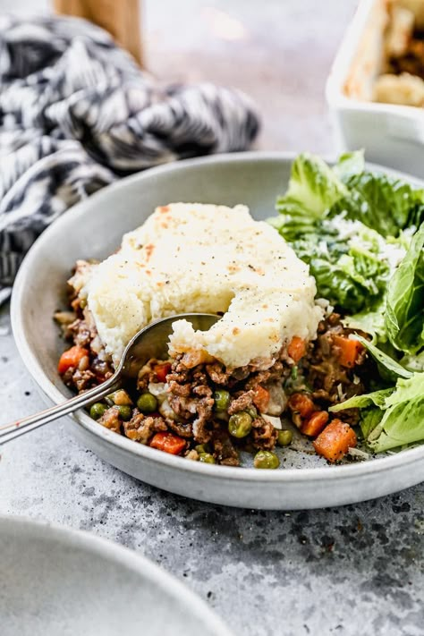 Hearty, healthy, and easy, this Shepherd's Pie is the perfect meal for the entire family! A flavorful base of ground beef or lamb and vegetables is topped with a fluffy, buttery potato topping! #wellplatedrecipes #shepherdspie #healthyfamilymeals #cottagepie Well Plated By Erin, Buttery Potatoes, Easy Shepherds Pie, Well Plated, Cheesy Mashed Potatoes, Shepherds Pie Recipe, Potato Toppings, Baked Vegetables, Savory Dishes