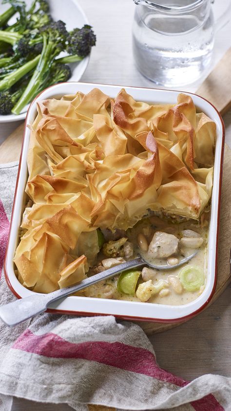 A rectangular casserole dish with a golden, crinkly filo-topped pie. A slice is removed to reveal chicken, leeks and beans. Broccoli Pie Recipe, Broccoli Pie, Filo Pie, Bean Pie, Salmon And Broccoli, Family Dinner Night, Chicken Cauliflower, Joe Wicks, Chicken Pie