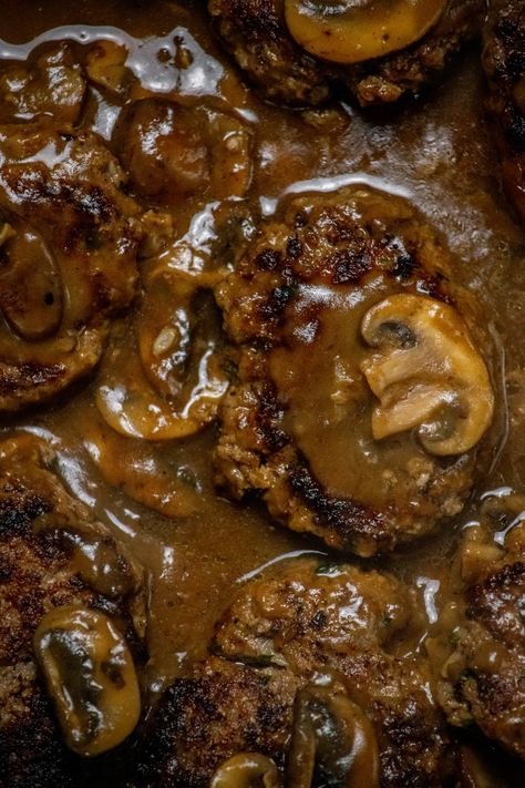 One of the best comfort foods, this Moist Burger Steak Recipe with Mushroom Gravy is a savory and satisfying weeknight meal for any night of the week! With tender beef patties and a flavorful fresh mushroom gravy. Steak Patties And Gravy, Brown Gravy Smothered Hamburger Steaks, Hamburger Patties With Mushroom Gravy, Hamburger Patty Salisbury Steak, Hamburger Steaks And Gravy, Hamburger Mushroom Recipes, Best Hamburger Steak Recipe, Smothered Hamburgers, Hamburger Steaks With Mushroom Gravy