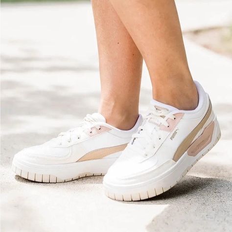 Puma Is Back!!!!!!! Puma Cali Dream Sneakers 5.5, 6, 6.5, 7, 7.5, 8, 8.5, 9, 9.5, 10, 10.5, 11 125.00 New Colour: White & Sand Puma Estimated Date: Jul 26 Crystal's Puma Cali Dream Sneakers Review: There Are So Many Features About This Sneaker That I Just Love. First Off, It’s Leather! Score! I Love The Chunkier Look. The 1.5” Platform Gives Me A Bit More Height, Which Is Right Up My Ally. It’s Not Just A Basic White Sneakerit Has Mix Of Beige Shades Throughout. It Has A Cushioned Sole And Is Super Comfy! I’m Wearing My Usual Size 8 And Find Them True To Size Www.Silvericing.Com/Style2020 Dream Sneakers, Beige Shades, Ladies Sneakers, Puma Cali, Puma Women, Pumas Shoes, White Sand, White Sneaker, Cali