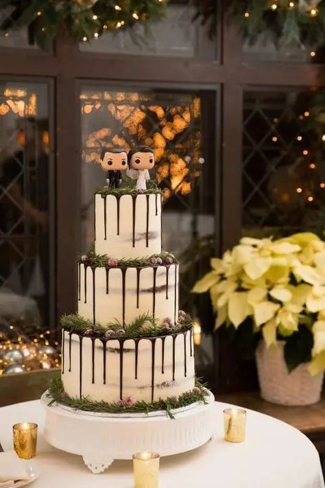 Wedding cake inspiration featuring a Funko Pop couple and a chocolate drizzle from our Holiday Mansion Lookbook. Willowdale Estate is a wedding and events venue in Topsfield, Massachusetts. Funko Pop Wedding, Maximalism Wedding, Maximalist Wedding, Cake Themes, Willowdale Estate, Pop Wedding, Big Wedding Cakes, Bobble Heads, Themed Wedding Cakes