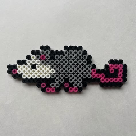 Mini opossum Perler bead art. Measures approximately 5" wide and 2" tall. Perfect size for a window hanging or keychain! Perler Beads Small Cute, Pony Bead Opossum, Kandi Patterns Pixel Art, Axolotl Perler Bead Patterns, Tbh Creature Perler Beads, Perler Beads Opossum, Bead Perler Pattern, Paw Patrol Perler Beads, Simple Perler Beads