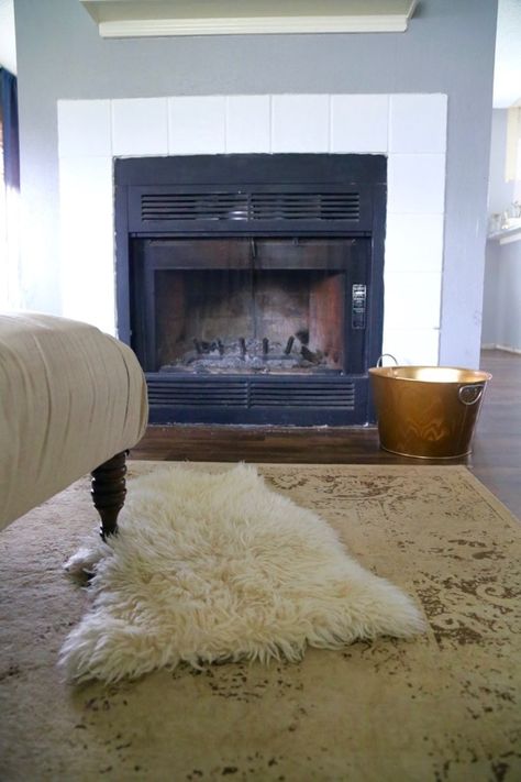 Tips and tricks for how to decorate with a sheepskin rug in your home. Ideas for how a sheepskin rug can be used in your house. #home #homedecor #sheepskin #sheepskinrug #decorating #decor Fur Rug In Front Of Fireplace, Sheepskin Rug On Carpet, Sheepskin Rug Bedroom Ideas, Rugs In Front Of Fireplace, Fur Rug Fireplace, Sheepskin Bedroom, Faux Fur Rug Living Room, Sheepskin Rug Living Room, Ikea Sheepskin Rug