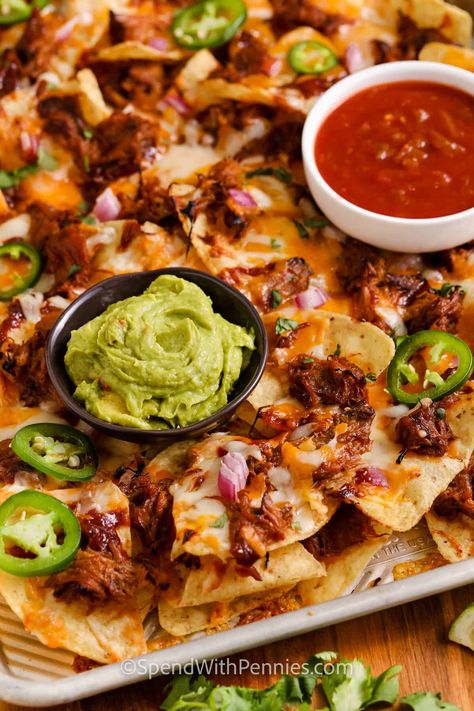 Serve these pulled pork nachos for a game day appetizer or even an afternoon snack. These hearty nachos are made with BBQ pulled pork, cheese, tortilla chips, and more extra toppings. Loaded nachos like these are sure to get rave reviews! #pulledporknachos #pulledporknachosrecipe #nachos #spendwithpennies Pulled Pork Nachos Recipe, Pulled Pork Sauce, Nachos Loaded, Easy Pulled Pork, Homemade Bbq Sauce Recipe, Pulled Pork Nachos, Pork Nachos, Slow Cooker Bbq Chicken, Pulled Pork Leftovers