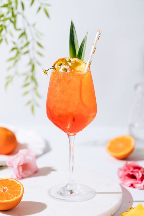 Tropical Tangerine Aperol Spritz - The Social Sipper Aperol Spritz Variation, Spritz Aesthetic, Summertime Cocktails, White Wine Spritzer, Aperol Spritz Recipe, Tangerine Juice, Spring Cocktail, Italian Liqueur, Spritz Recipe