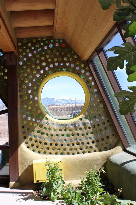 Recycled, reused, and beautiful - the Earthship Biotecture in Taos, New Mexico. An Earthship is a type of passive solar house that is made of both natural and upcycled materials such as earth-packed tires, pioneered by architect Michael Reynolds. Earthship Biotecture, Eco Construction, Cob Building, Eco Buildings, Bottle House, Earthship Home, Earthy Home, Natural Homes, Bottle Wall