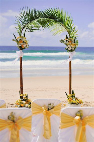 Celebrating at the beach can be as easy as a few palm fronds, flowers, sunshine and sashes. Delightful! Palm Tree Wedding Arch, Beach Wedding Arch, Wedding Alters, Wedding Wednesday, Ishigaki, Wedding Arches, Palm Trees Beach, Beach Ceremony, Beach Wedding Decorations