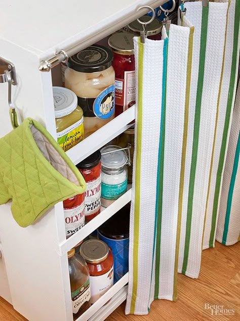 Turn a bookcase into a petite movable pantry with the addition of casters and painted lath attachments designed to secure pantry goods when the cart is in motion. Add a curtain rod to support kicky clipped-on dish towels that can be drawn closed to keep supplies under wraps until they're needed./ Camera Shabby Chic, Decor Cozinha, Cafe Rod, Decorating Above Kitchen Cabinets, Open Cabinet, Above Kitchen Cabinets, Barbie Outfits, Small Kitchen Decor, Rolling Storage