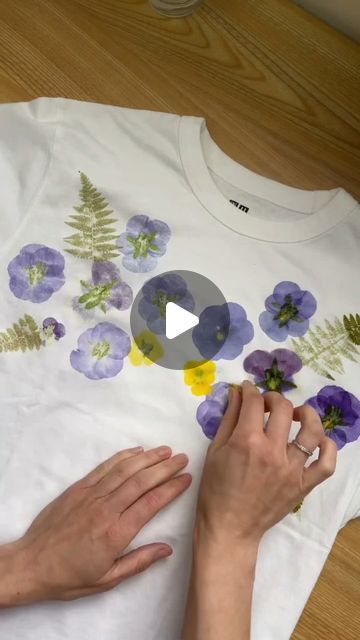 Custom WearHouse on Instagram: "Flower-printed tee 🌸💐 by @hammerflower  . This botanical printing method is achieved by hammering flowers into the fabric! ✨️ What do you think of this technique? . . . . #botanicalart #botanicalprint #flowerpressing #flowerprint #floralprint #floralfashion #floralart #naturaldye #customtees #handprintedtextiles #textileart #tshirtprinting" Hammer Print Flowers, Flower Printing With Hammer, Flower Hammering On Fabric, Pressed Flowers On Fabric, Hammer Flowers On Fabric, Hammering Flowers On Fabric, Pounded Flowers On Fabric, Hammered Flowers On Fabric, Botanical Printing On Fabric