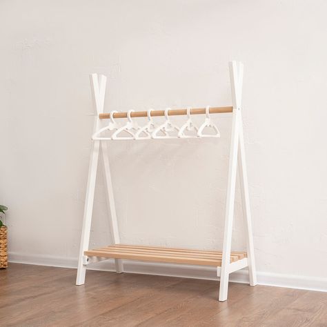 Introducing the Child Clothes Rack by WoodandHearts, a beautifully crafted piece with a universal design that seamlessly fits into any Montessori-inspired space. This multifunctional rack allows children to hang their clothes, sit while putting on shoes, store toys and engage in pretend play. The combination of elegance with practical features, makes it an essential addition to your child's room. Perfect for fostering independence, organization, and imaginative play, this toddler's clothes rack Nursery Clothes Rack, Montessori Clothes Rack, Baby Rack, Clothes Rack Design, Playhouse Indoor, Organizing Clothes, Bow Designs, Montessori Room, Child Clothes