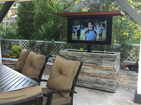 Outdoor TVs can be a welcome addition to anyone’s outdoor patio or living space. Watching that night game under the stars is a tough feeling to beat. Selecting the right TV though can be intimidating. What are the pros and cons of owning an outdoor TV? Can’t you just pop any old TV outside? What are things you should watch out for and more importantly what makes a great outdoor TV great? This outdoor TV buying guide is going to break all of that down for you and more. Outdoor Hidden Tv, Tv Outside, Outdoor Tvs, Patio Tv, Outdoor Tv Cabinet, Island Cabinet, Traditional Patio, Tv Lift Cabinet, Tv Lift