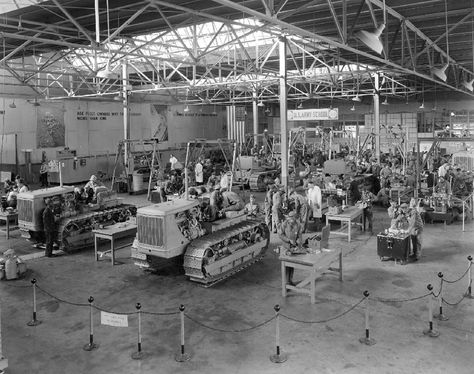 Caterpillar Army Training School, World War II, in the former Showroom in Building HH, East Peoria, Illinois, USA, ca. 1942. #tbt #throwbackthursday Normandy Landings, Rockwell Paintings, Norman Rockwell Paintings, East Peoria, Peoria Illinois, Normandy Beach, Army Training, Royal Engineers, Training School