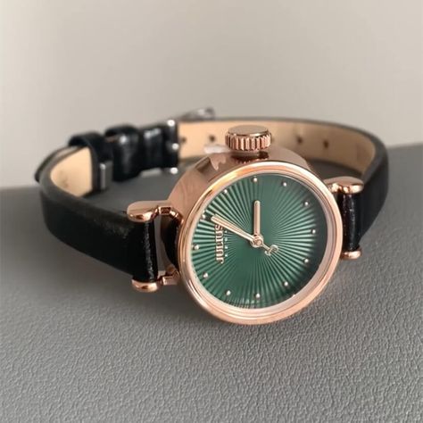 The Vintage Green Leather Watch blends sophistication with a hint of retro charm. Featuring a striking green sunray dial with sparkling dot markers, this watch offers an elegant contrast with its rose gold-tone case. Paired with a sleek black leather strap, it provides a comfortable fit and a timeless appeal, making it a perfect accessory for any occasion. Dot Markers, Green Leather, Leather Watch, Leather Straps, Markers, Gold Tones, Vintage Style, Comfort Fit, Black Leather