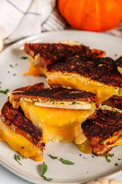 Pumpkin Grilled Cheese Sandwich - Ultra comforting and delicious, this grilled cheese uses pumpkin sandwich bread, pumpkin puree, three types of melty cheese a little fresh sage and some apple slices for extra crunch. From aberdeenskitchen.com Pumpkin Sandwich, Fall Sandwiches, Caprese Panini, Chevre Cheese, Autumn Countryside, Bread Pumpkin, Recipe Inspirations, Making Grilled Cheese, Refreshing Beverages