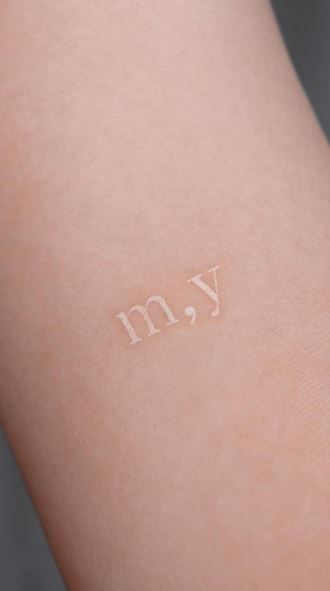 Minimal Tattoo On Wrist, Simple White Tattoos, Clear Ink Tattoo, White Color Tattoo, White Letter Tattoo, White Ink Heart Tattoo, Tattoos White Ink, Whispy Tattoos, Tiny White Tattoos