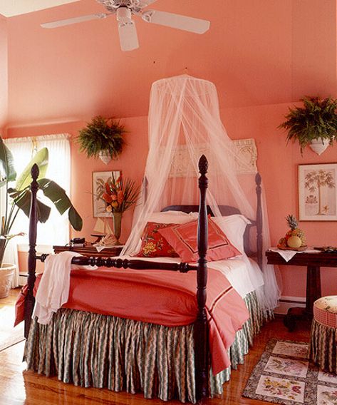 The coral-hued bedroom is reminiscent of a Caribbean bungalow — complete with mosquito netting and exotic flowers.  - GoodHousekeeping.com Caribbean Interior, Caribbean Interior Design, Nice Bedrooms, Painting Rooms, Peach Bedroom, Coral Room, Colour Pallettes, Coral Bedroom, Bedroom Beautiful