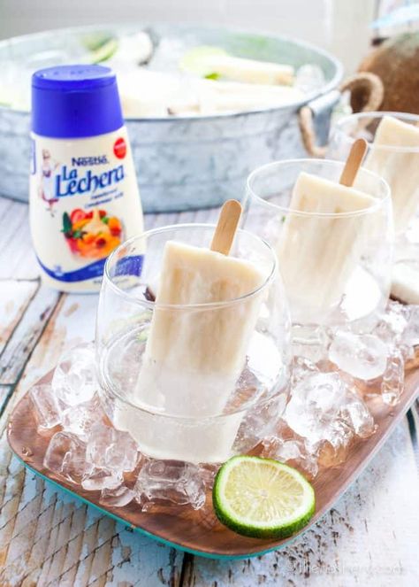 Summer coquito is a simple coconut rum and soda cocktail chilled and served with a creamy coconut popsicle. Popsicle cocktails are a great way to stay cool. Popsicle Cocktail, Coconut Popsicles, Boozy Popsicles, Coconut Margarita, Puerto Rican Dishes, Edible Crafts, Puerto Rican Recipes, Coconut Rum, Fun Easy Recipes