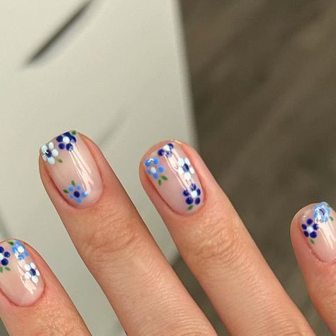 Shelley Graham on Instagram: "Ad) Freshly done nails, blooming with delicate blue flowers, perfect for spring vibes!  Colours from @the_gelbottle_inc  Signature  Sunday  Michelle   #blueflowers #nailart #flowernails #springnailart #floralnails #gelpolish #gelnailart #thegelbottle #thegelbottleinc #tgb #shortnails #shortnailart #simplenails #manicure #mani #folkestone #kent #nailinspiration #nailitdaily" Flower Gel Manicure, Flower Heart Nails, Flower Biab Nails, Biab Colours, Shellac Flower Nails, Nail Ideas Blue Flowers, Blue Flower Nail Art, Shellac Nails Blue, Blue Nails Flower