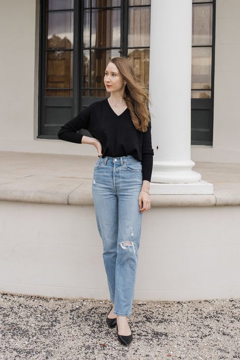 A girl wearing a black knit top and Levi's ribcage straight ankle jeans, minimalist fashion ideas, minimalist outfits, capsule wardrobe inspiration. Levi’s Ribcage Straight Ankle Outfit, Levi’s Ribcage Straight Ankle Jeans Outfit, Levi’s Ribcage Straight Ankle, Levi’s Ribcage Jeans, Levi’s Ribcage Outfit, Ankle Straight Jeans Outfit, Levis Ribcage Straight Ankle Jeans Outfit, Straight Ankle Jeans Outfit, Levis Ribcage Jeans Outfit