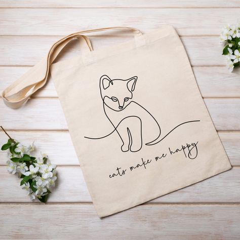 Cute happy cat tote bag | kitty lover | cat mom gift | funny grocery tote | kitten one line drawing | pet gift | cats make me happy by ZellaJoy on Etsy Tote Bag Cat Design, Cat Tote Bag, Cat Christmas Gift, Dashboard Header, Cats Tote Bag, One Line Drawing, Cat Mom Gifts, Cat Tote, Cat Fashion