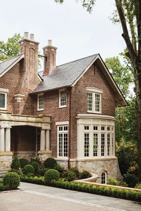 Period-style details, including an iron band that links the two clay-pot chimneys in the front, are the Tudor’s defining features. Garden Pathways, Tudor Style Homes, Brick Exterior House, Tudor House, Tudor Style, Architecture Exterior, Stone Houses, House Goals, Brick House