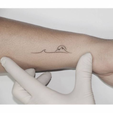 Minimalistic style mountain and wave tattoo located on North Shore Tattoo, Mountain And Wave Tattoo, Mountains And Ocean Tattoo, Tiny Mountain Tattoo, Mountain And Ocean Tattoo, Moutain Tattoos, Simple Wave Tattoo, River Tattoo, International Tattoo